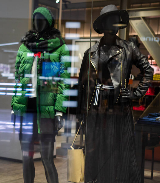 Showcase with clothes behind the glass.