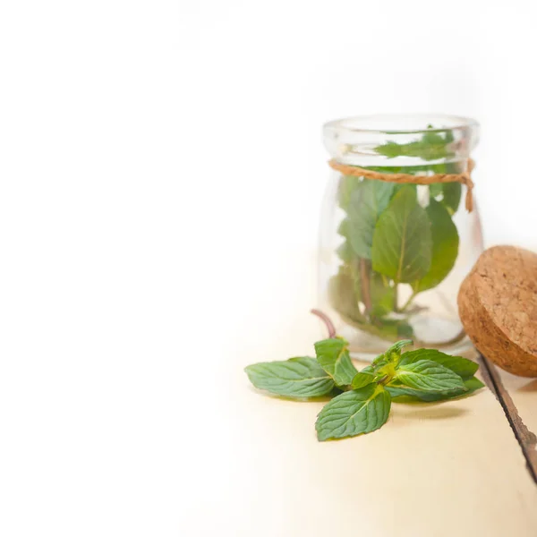 Fresh mint leaves on a glass jar — Stock Photo, Image