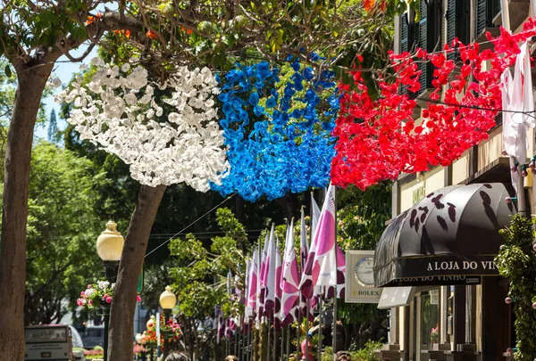 Colorful decorations  from garlands over streets during the Madeira Wine Festival in Funchal on Madeira Island. Portugal — Stock Photo, Image