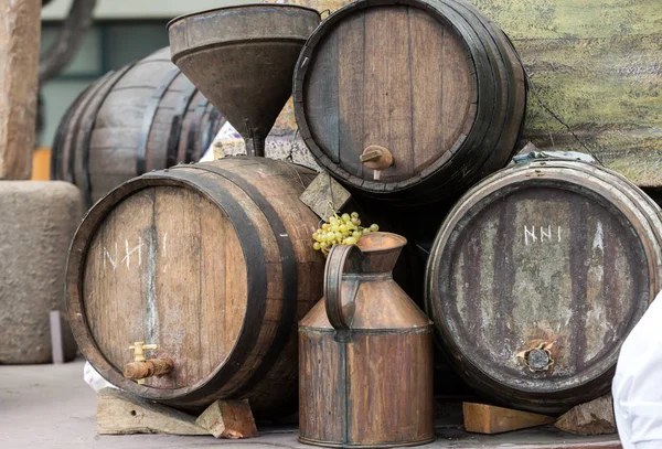 Old barrels and tools for wine production — Stock Photo, Image