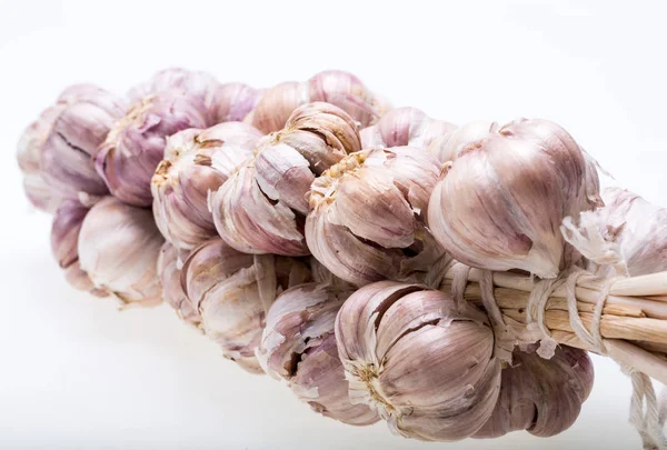 String of garlic isolated on white background — Stock Photo, Image