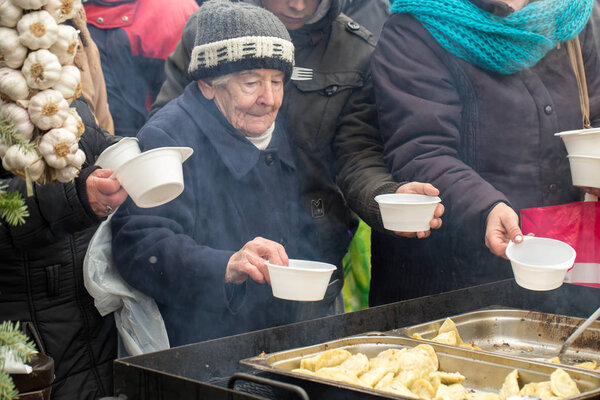  Christmas Eve for poor and homeless on the Central Market in Cracow. Every year the group Kosciuszko prepares the greatest eve in the open air in Poland