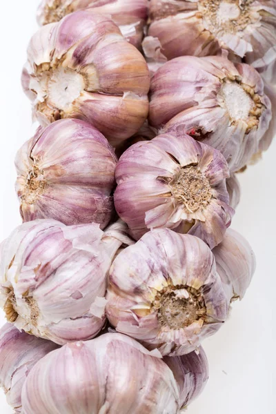 String of garlic isolated on white background — Stock Photo, Image