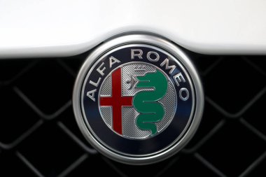 Alfa Romeo metallic logo closeup on Alfa Romeo car displayed at 3rd edition of MOTO SHOW in Cracow Poland. Exhibitors present  most interesting aspects of the automotive industry clipart