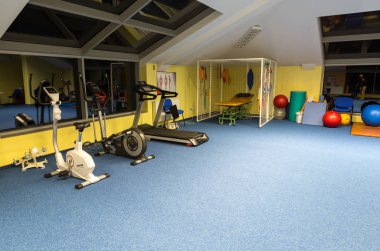 WISLA, POLAND - OCTOBER 23, 2105: Gym and fitness room at the rehabilitation center for the disabled in Wisla, Poland clipart