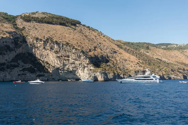 Luxury crewed motor yacht on the Amalfi Coast near Positano, Campania. Italy