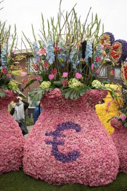 Noordwijkerhout, Netherlands - April 21,  2017: Platform with  tulips and hyacinths during the traditional flowers parade Bloemencorso from Noordwijk to Haarlem in the Netherlands.  clipart