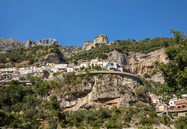 Panorama of Positano with houses climbing up the hill, Campania, Italy