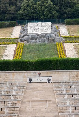 Montecassino, Italy - June 17, 2017: Polish War Cemetery at Monte Cassino - a necropolis of Polish soldiers who died in the battle of Monte Cassino from 11 to 19 May 1944. Italy clipart