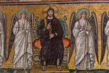 Ravenna, Italy - Sept 11, 2019: Mosaic of the enthroned Christus with four vanguard angels in Basilica of St Apollinare Nuovo in Ravenna, Italy