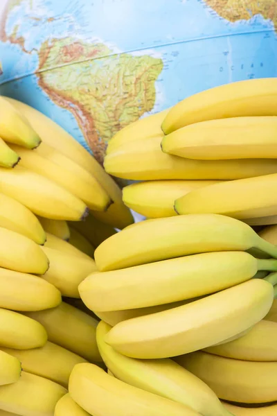 Fresh bananas and South America map — Stock Photo, Image