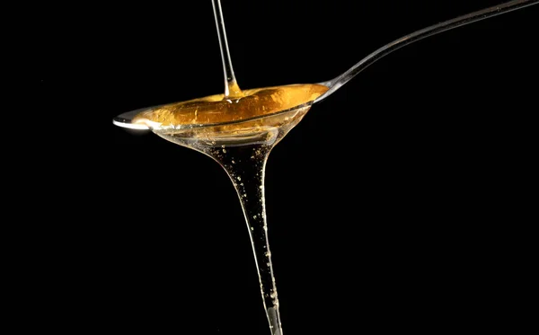 Honey Pouring Spoon Isolated Black Background — Stock Photo, Image