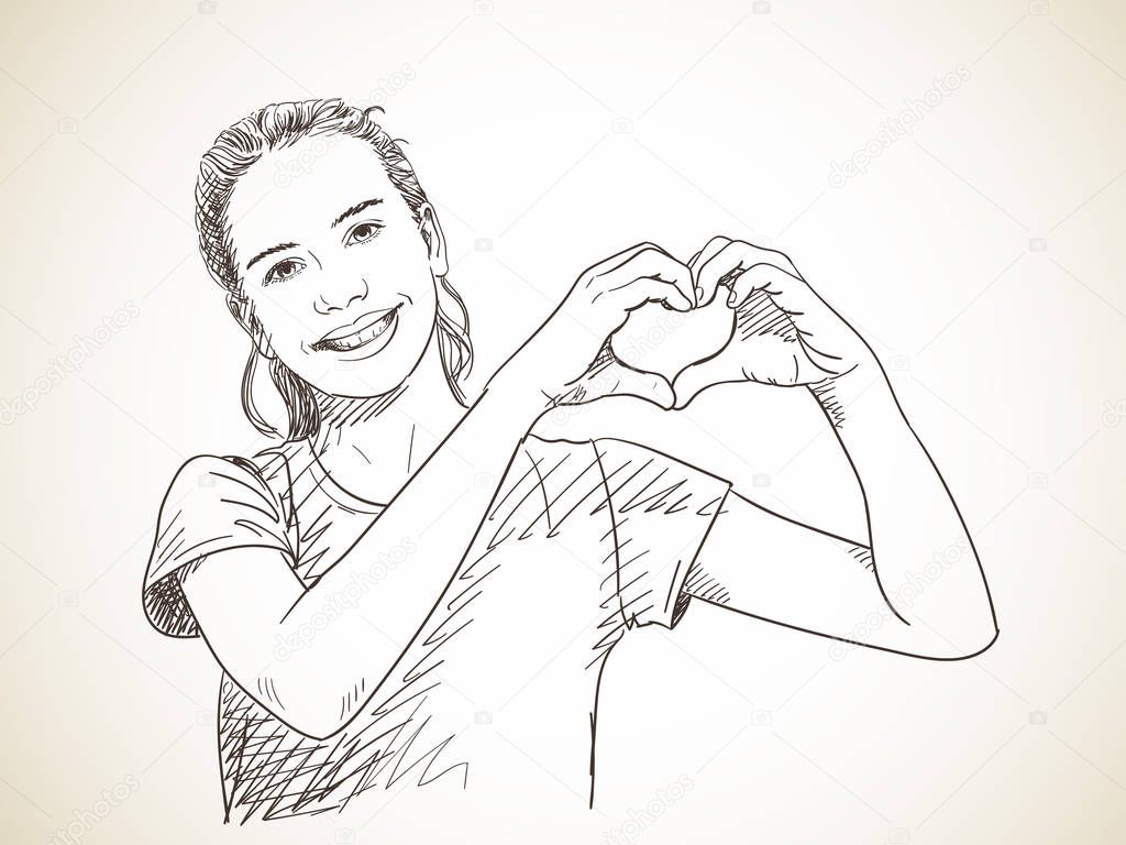 girl showing hands in heart form