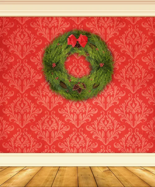 Červené damaškové zeď s vánoční věnec — Stock fotografie