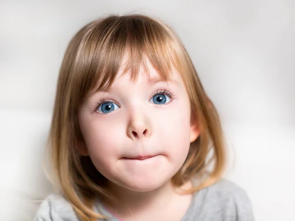 Emotional portrait of a beautiful little girl. Stock Image