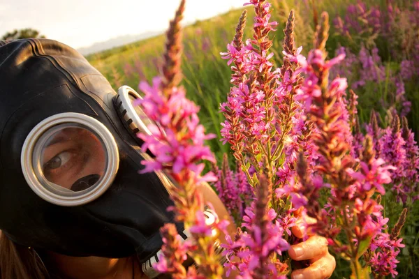 Woman with gas mask and pink flowers
