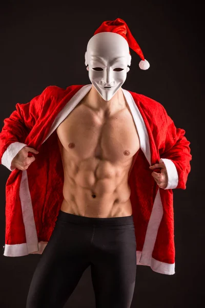 Sexy santa claus nosí masku — Stock fotografie