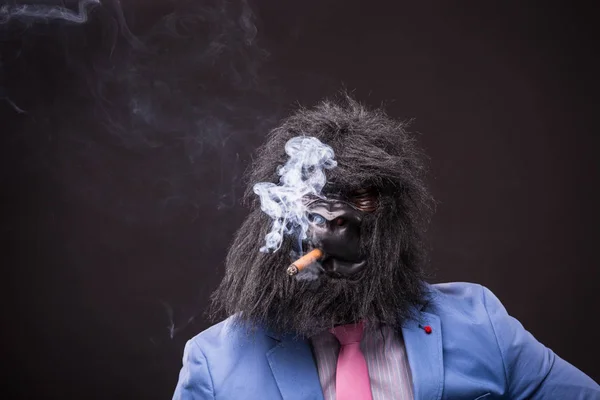 businessman wearing gorilla mask