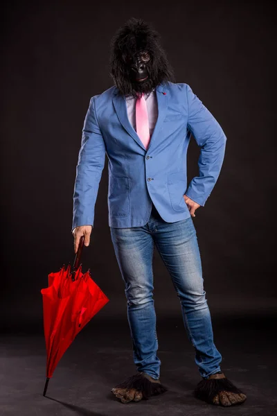 businessman wearing gorilla mask