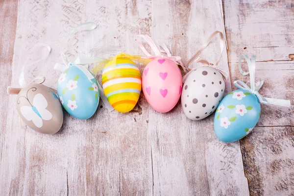 Easter eggs on rustic wooden background — Stock Photo, Image