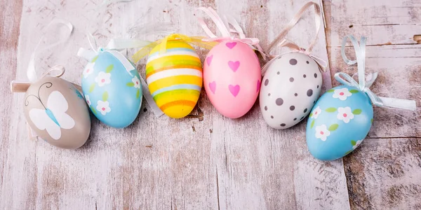 Easter eggs on rustic wooden background — Stock Photo, Image