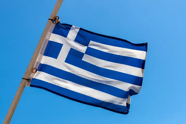 National Greek flag on the yardarm of the ship