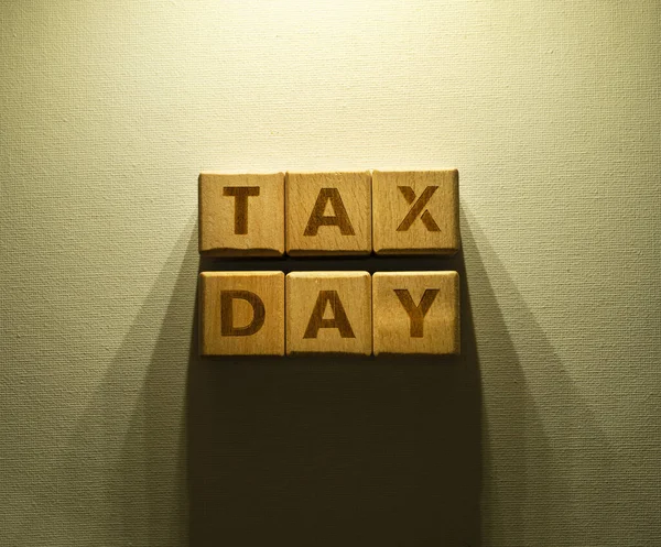 Tax Day Word Written On Wood Blocks