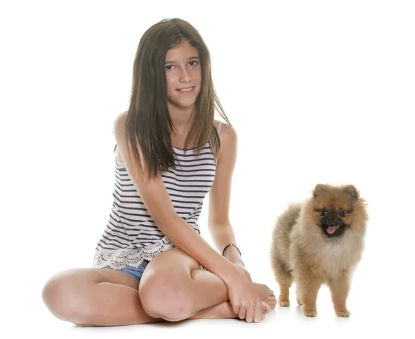 Young pomeranian dog and teen — Stock Photo, Image