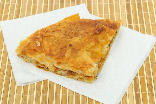 Crispy Pizza burek or pie on a paper serviettes — Stock Photo, Image
