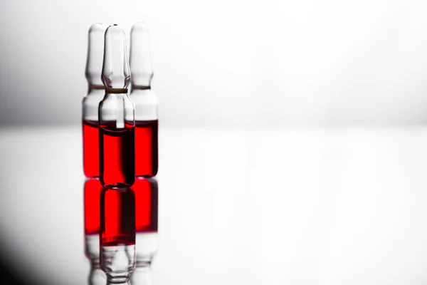 Group of ampoules with a transparent medicine in medical laborat — Stock Photo, Image