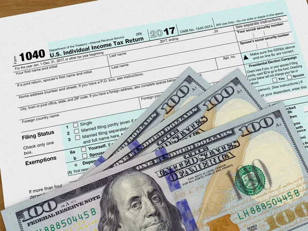 Tax form 1040 and dollars — Stock Photo, Image