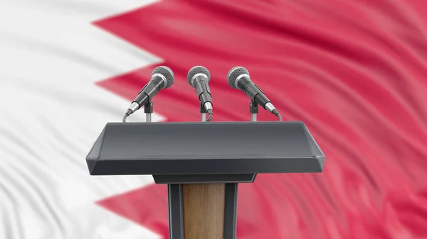 Podium lectern with microphones and Bahrain Flag in background