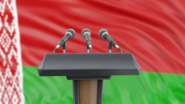 Podium lectern with microphones and Belarus Flag in background