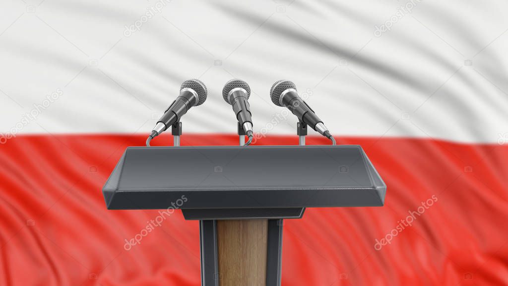 Podium lectern with microphones and Polish flag in background