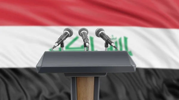 Podium lectern with microphones and Iraq Flag in background