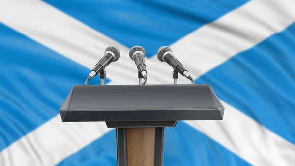 Podium lectern with microphones and Scottish Flag in background