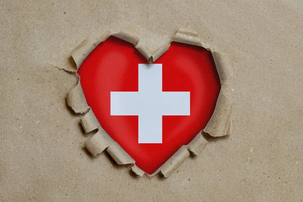 Heart Shaped Hole Torn Paper Showing Swiss Flag — Stock Photo, Image