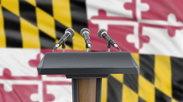 Podium lectern with microphones and Maryland flag in background