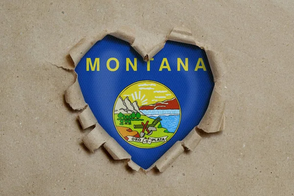 Heart Shaped Hole Torn Paper Showing Montana Flag — Stock Photo, Image