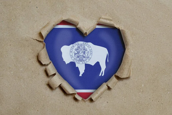 Heart Shaped Hole Torn Paper Showing Wyoming Flag — Stock Photo, Image