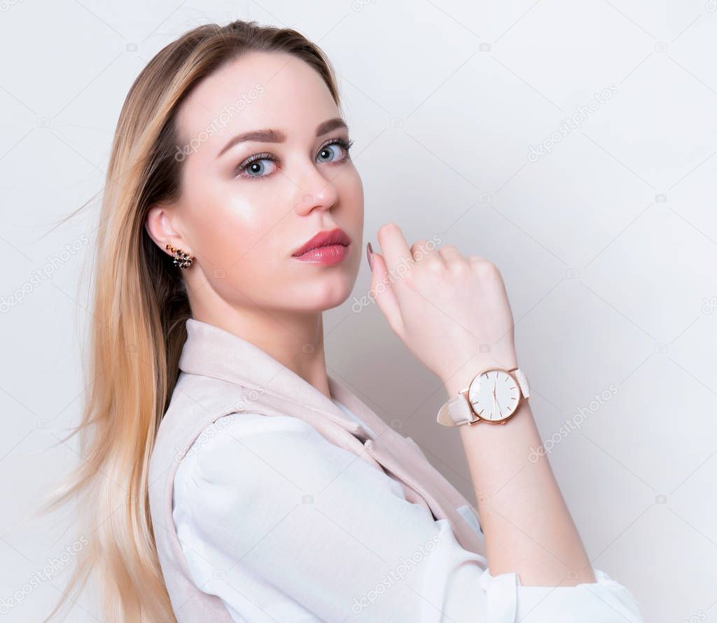 beautiful young woman with long hair wearing wrist watch