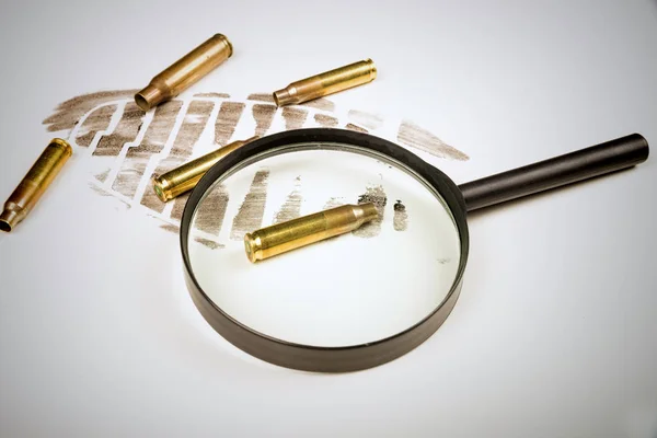 Footprint and bullet shells — Stock Photo, Image