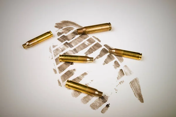 Footprint and bullet shells — Stock Photo, Image