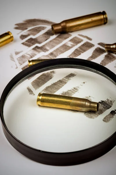 Footprint and bullet shells — Stock Photo, Image