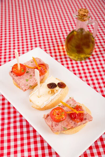 Pate tapa on bread with cherry tomatoes — Stock Photo, Image