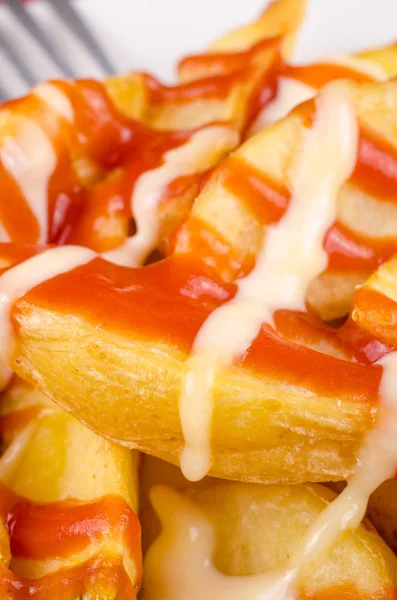 Thick chips with ketchup and mayo — Stock Photo, Image