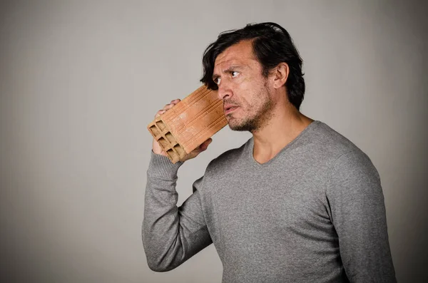 Using a brick phone, a concept on obsolete technology — Stock Photo, Image