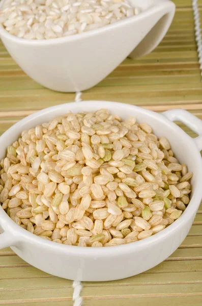 Small bowl of whole rice — Stock Photo, Image