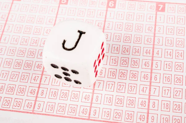 Dice on lottery ticket — Stock Photo, Image