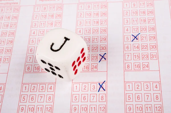 Dice on lottery ticket — Stock Photo, Image